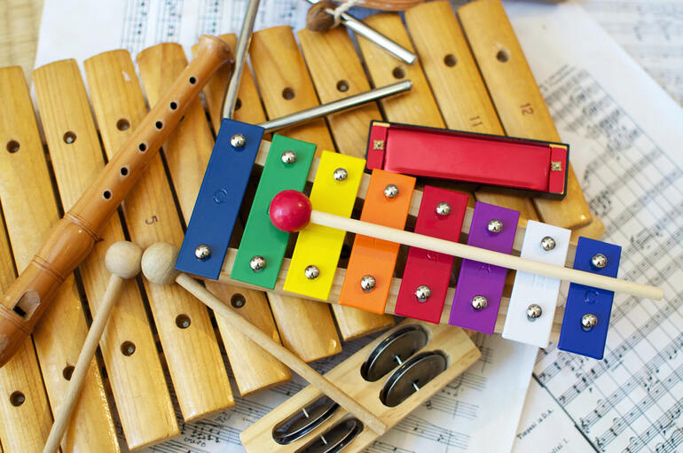 Colourful classroom musical instruments, including xylophone and recorder
