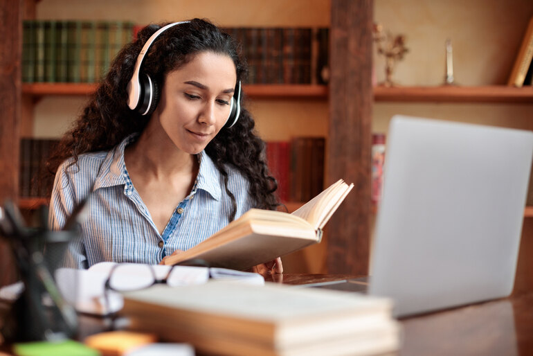 A student is listening to music while studying