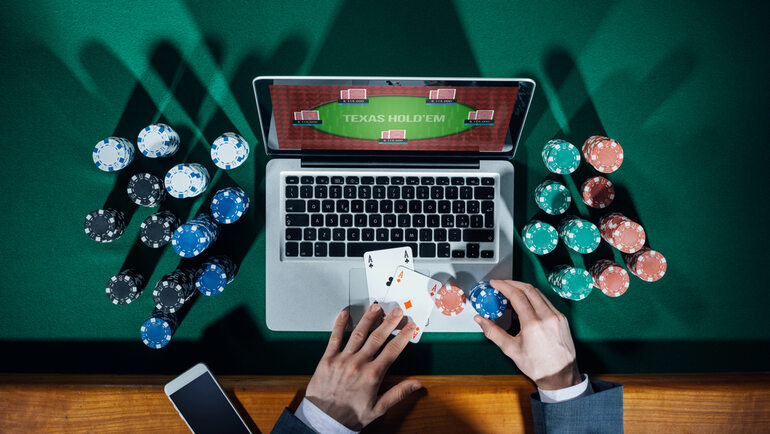 A gambler playing games on a reliable Toto site on a laptop