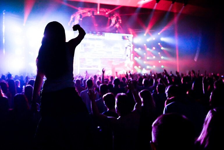 Energetic crowd jumping and enjoying a live concert