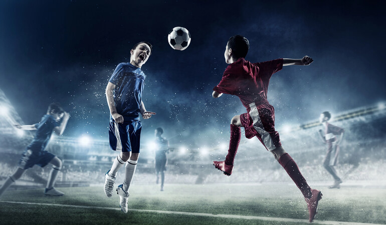 Young athletes in action on a high-tech soccer field