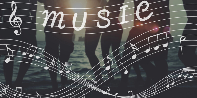Silhouetted people dancing by the ocean with musical notes overlaid