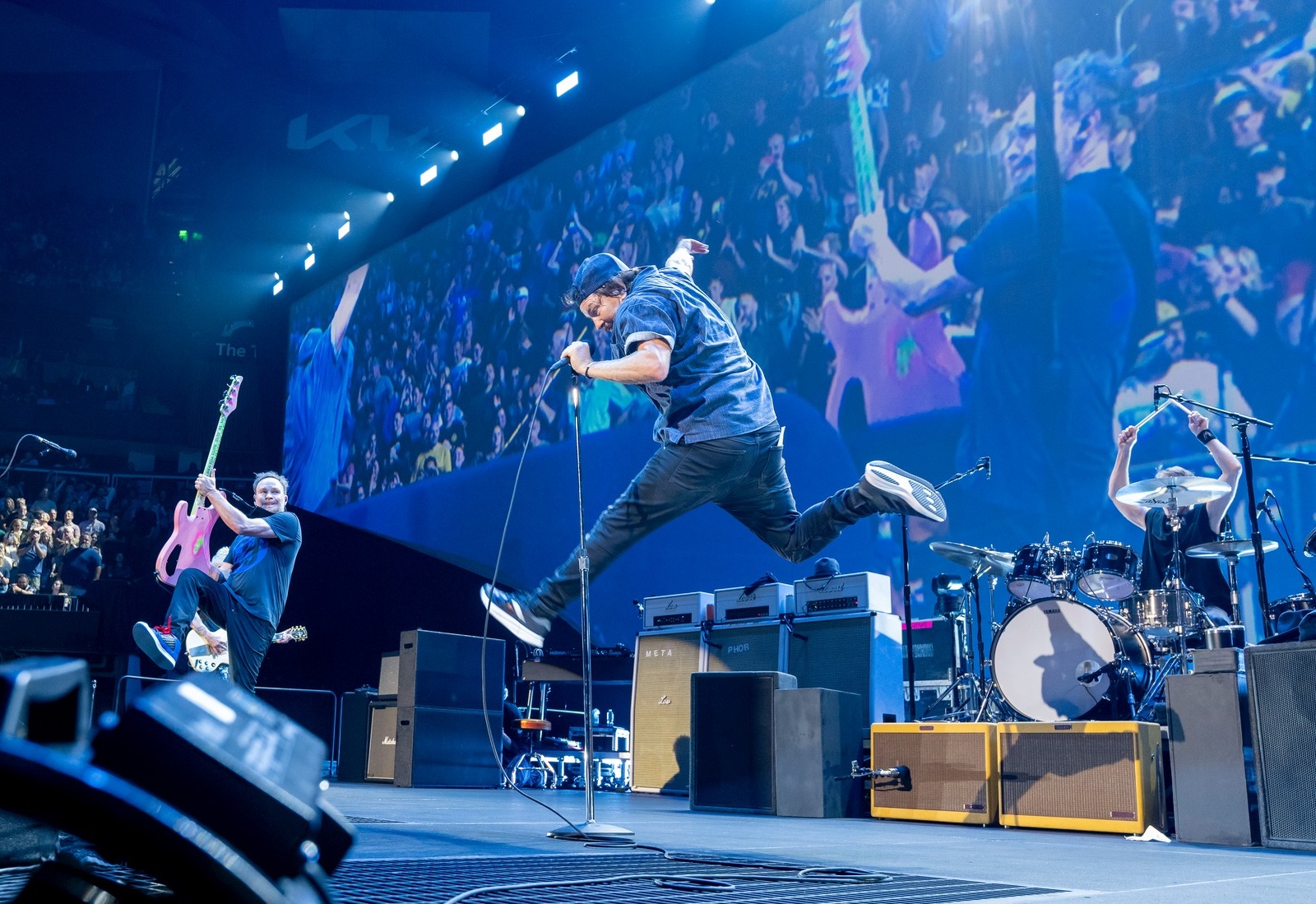 pearl jam performs in Atlanta, Georgia. Eddie vedder leaps