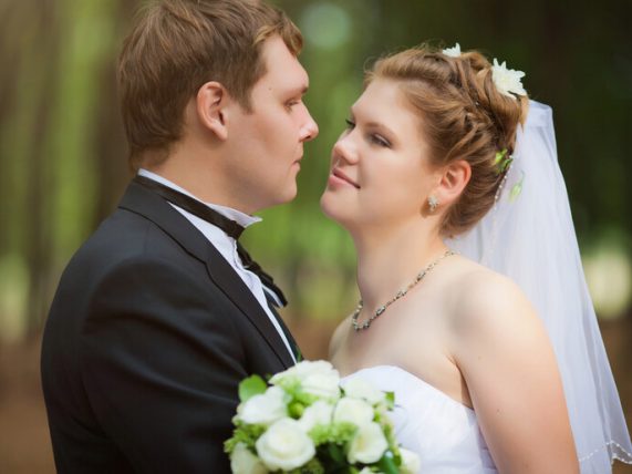 Bride and groom on their wedding day, representing the personal aspect of mail-order marriages
