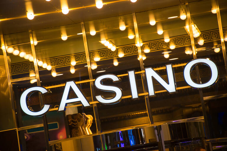 Casino entrance with lights, highlighting top live music and casino nights in 2025