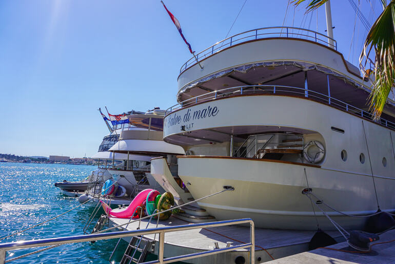 Luxury yachts docked at a sunny marina in the Bahamas