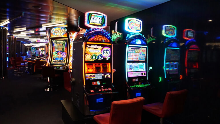 Music-themed casino gaming floor with illuminated slot machines and immersive entertainment atmosphere.