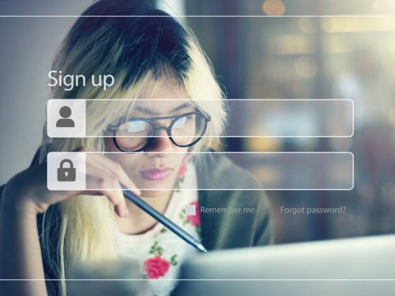 A woman is setting up a password on a digital platform