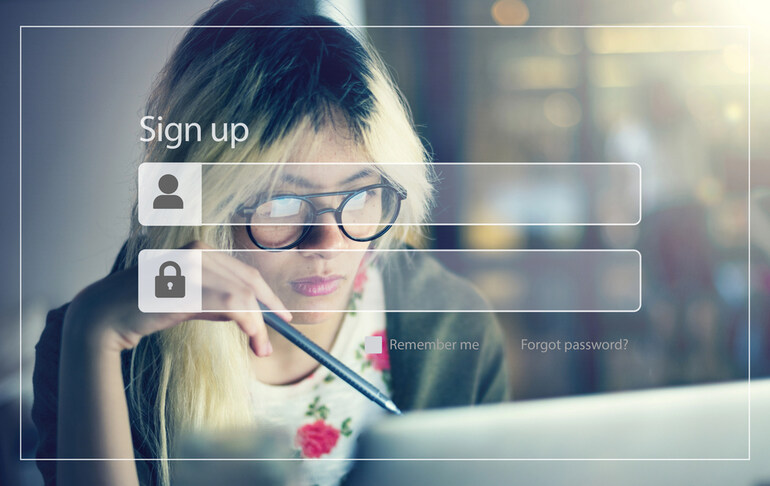 A woman is setting up a password on a digital platform