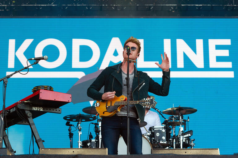 Kodaline performing live on stage with instruments and band setup
