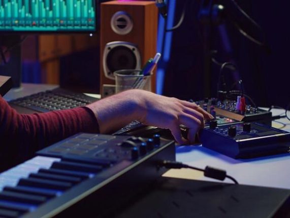 Live music production setup with lighting controls, sound equipment, and volume settings, illustrating how AI is changing backstage concert production.