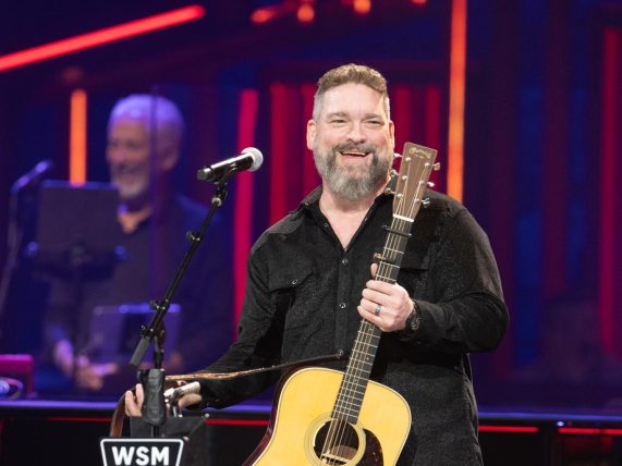Dave Fenley holding a guitar for Grand Ole Opry debut