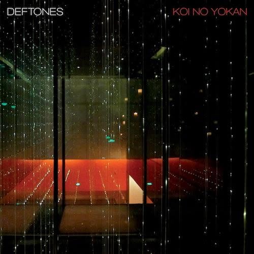 Deftones album cover for Koi No Yokan, featuring lights in a dark room with mirrors.