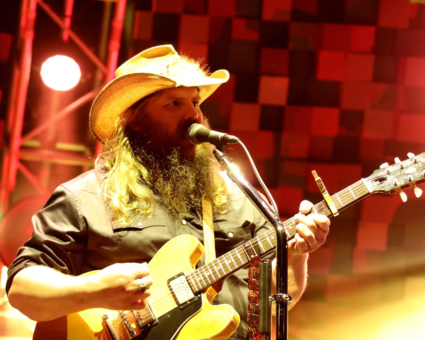 Country music singer Chris Stapleton performing live with guitar