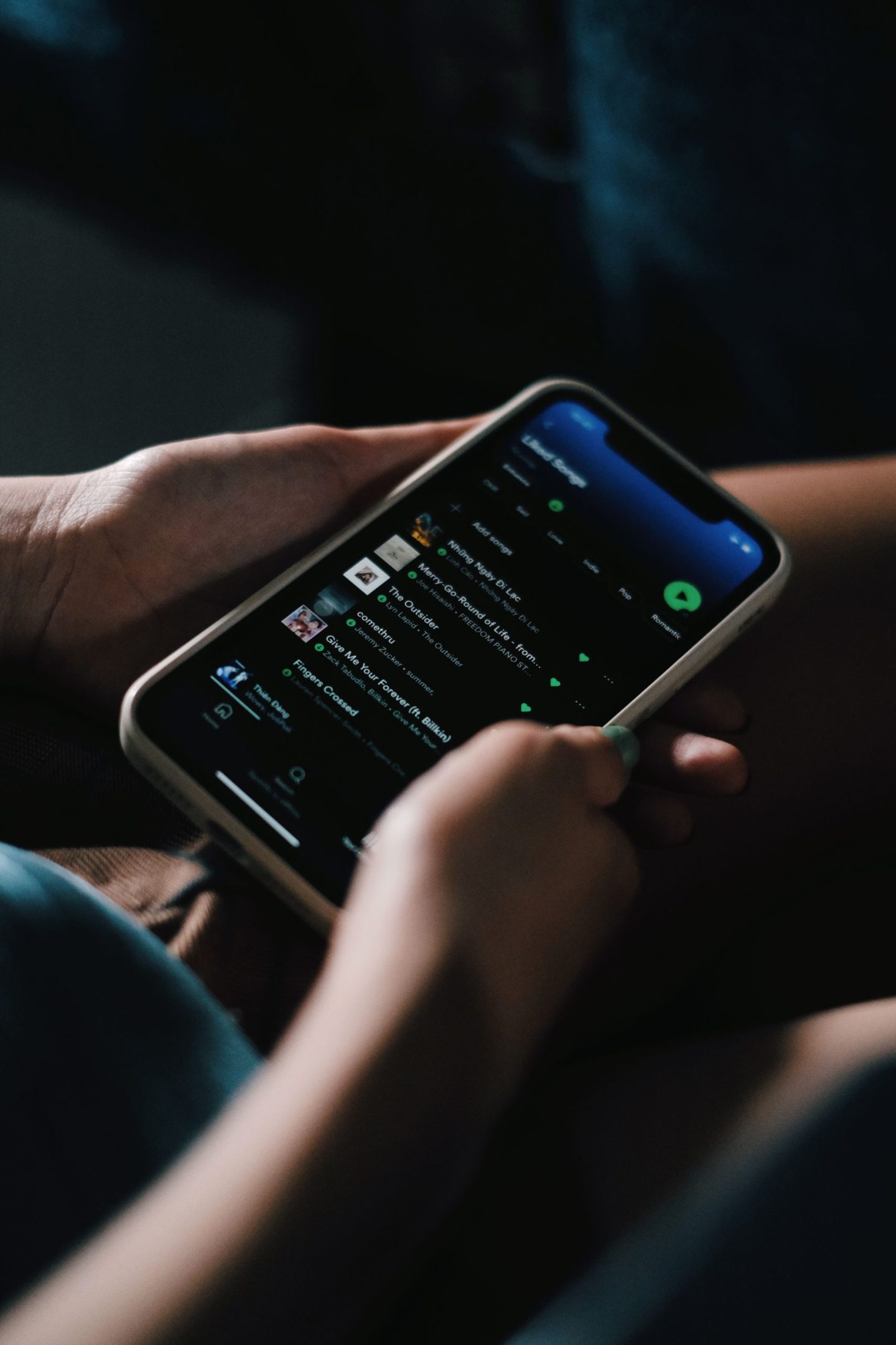 A phone making a playlist of Irish drinking songs
